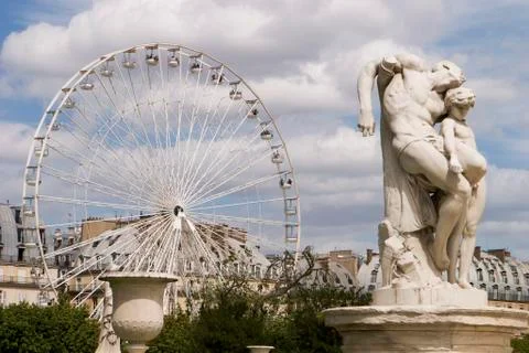 Ferris wheel with statue Stock Photos