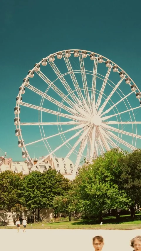 Ferris wheel on a summer day in Paris, time lapse, vertical video Stock Footage 282378256