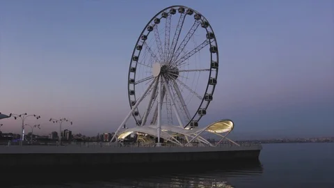 Ferris wheel at sunset under a beautiful sky Stock Footage 115058356
