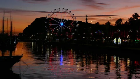 Ferris wheel turning at sunset. Stock Footage 197753784