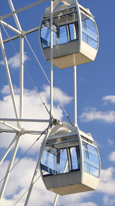 Ferris Wheel Under Cloudy Sky. Vertical. Stock Footage 295516308