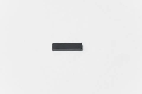 Ferrite rectangular magnet with north and south pole isolated on white Stock Photos