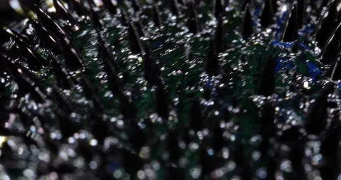 Ferrofluid tinted with colored paints. The surface of the black, blue liquid. Stock Footage 244007443
