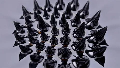 Ferromagnetic fluid (Ferrofluid) when exposed to a magnetic field creates ama Stock Photos