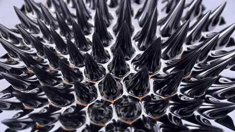 Ferromagnetic fluid (Ferrofluid) when exposed to a magnetic field creates ama Stock Photos