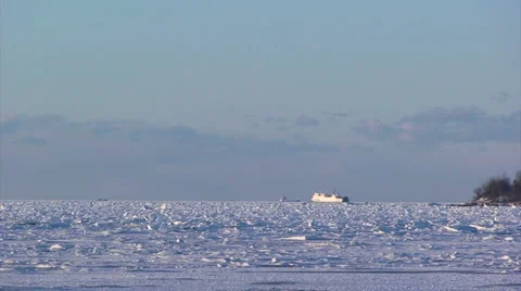 Ferry advancing across the icy Baltic Sea in the distance Stock Footage 52090368