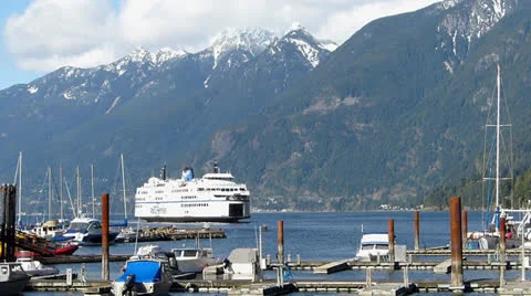 Ferry Approaches Terminal in Small Harbour Stock Footage 22543851
