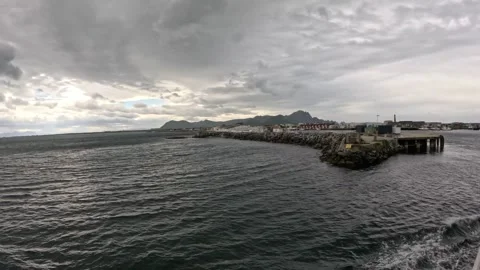 Ferry approaching Andenes harbor breakwater and mole in Andoya Norway 스톡 동영상 342755867