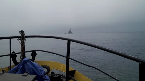 Ferry approaching lighthouse Stock Footage 129322639