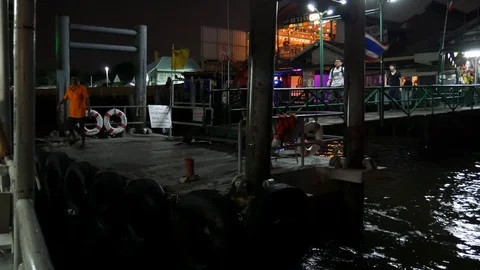 Ferry approaching a pier in Bangkok 動画素材 107909738