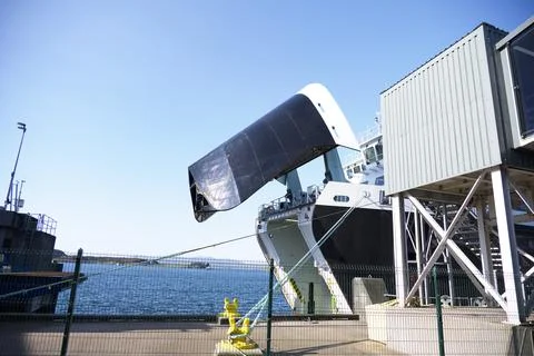 Ferry arrival with open from to offload export goods and vehicles in Oban Stock Photos