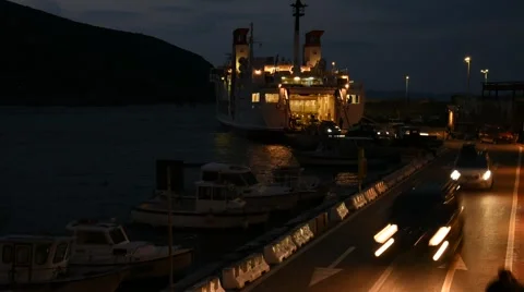 A ferry arrives in the harbor in the night Video stock 62257199