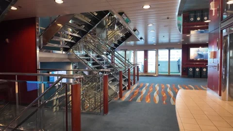 Ferry Atrium with Chrome Stairs, Patterned Carpet, and Bright Doors Vidéo 347683422