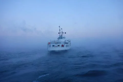 Ferry in the Baltic sea on freezing cold January winter morning Stock Photos