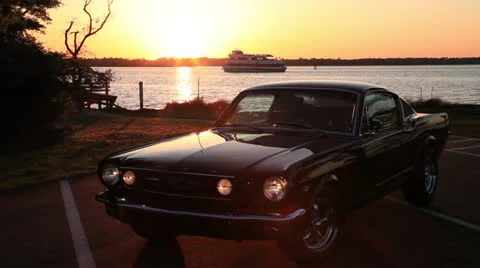 Ferry blocks sunset behind Mustang, 100% Stock Footage 23825629