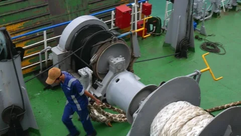 Ferry boat crew working on the deck of boat untying the ropes for the departure Stock Footage 237806797