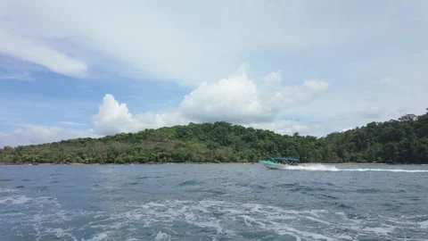 Ferry boat flying down the Pacific coast in Costa Rica near Drake's Bay Stock Footage 302691431