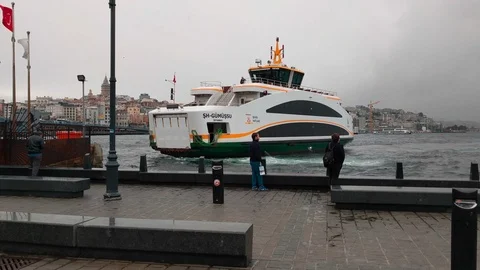 Ferry boat with passengers docking to pier station Eminonu Video stock 96558335