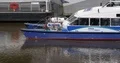 Ferry Boat Passing on Famous Thames River Touristic London Transportation Day 4k or 4k+ Resolution