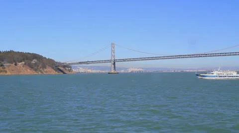 Ferry boat passing in front of the San Francisco Bay Bridge in the Bay 스톡 동영상 11876189