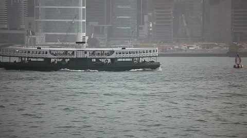 Ferry boat sailing in the river in front of Hong Kong skyline Stock Footage 97101993