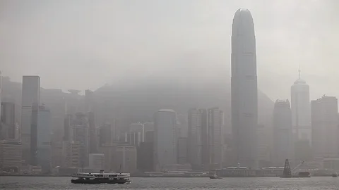 Ferry boat sailing in the river in front of Hong Kong skyline Stock Footage 97102040