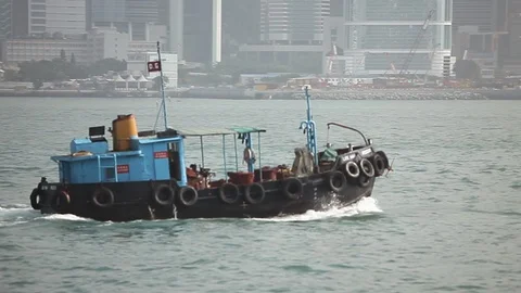 Ferry boat sailing in the river in front of Hong Kong skyline Stock Footage 97102068