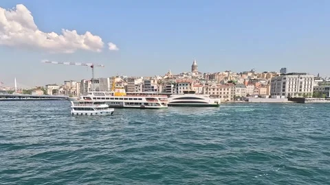 Ferry boats passing Galata Tower and Golden Horn waterfront in Istanbul Turkey Vídeos de archivo 331543899