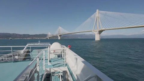 Ferry bow approaching port under cable bridge in strong windy sea Stock Footage 338107174