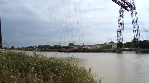 Ferry bridge with a gondola on the river charente. National monument. Rochefo Stock Footage 169050291