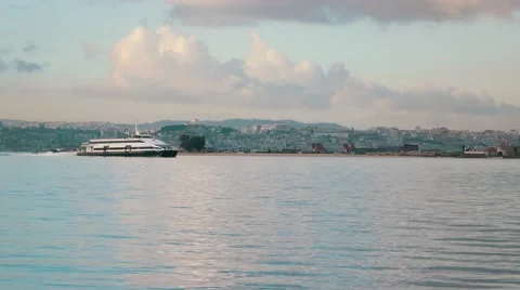 Ferry-Catamaran Sails on a Background of the City Stock Footage 59764272