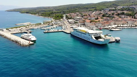 Ferry coming to the port on the Brač island in Croatia Stock Footage