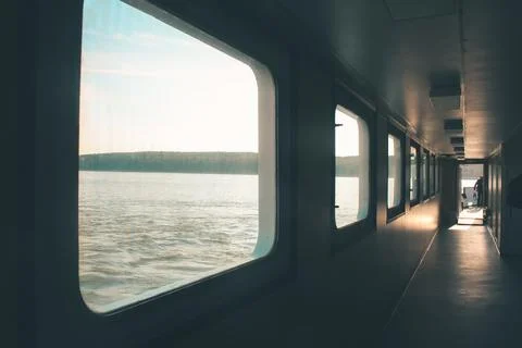 Ferry corridor, square windows, light falls on the floor. Transit from Klaipeda Stock Photos