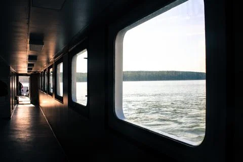 Ferry corridor, square windows, light falls on the floor. Transit from Klaipeda Stock Photos