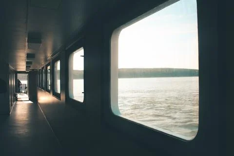 Ferry corridor, square windows, light falls on the floor. Transit from Klaipeda Stock Photos