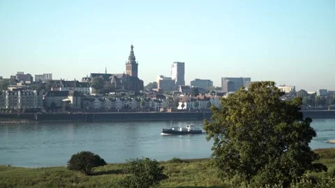 Ferry crossing river with cityscape in background Stock Footage 292924518