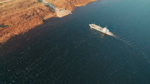 Ferry crossing the river. The view from the drone. Stock Footage 163546899