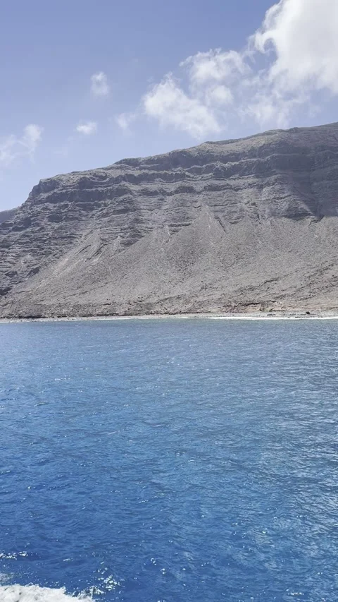 Ferry Crossing the Strait of Río Toward Risco de Famara of Lanzarote Stock Footage 321815509
