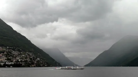 Ferry cruising on the background of massive mountains Video stock 38720032