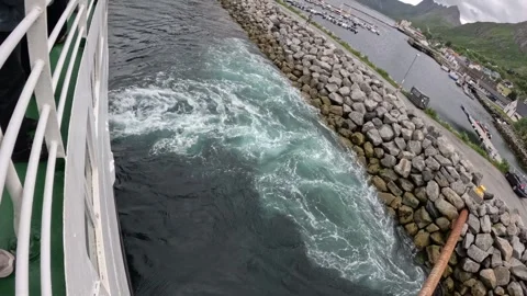 Ferry deck at foaming water wake and rock breakwater in Gryllefjord Norway 스톡 동영상 342755763