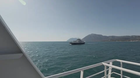 Ferry deck view with another ship passing close in open sea Stock Footage 338109437