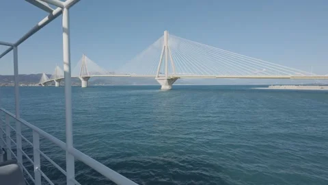 Ferry deck view towards Rio Antirrio bridge over calm sea in Greece Stock Footage 338108084