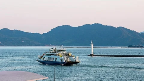 Ferry Departing at Dusk with White Lighthouse and Seto Inland Sea Islands,4K 库存影片 344440222