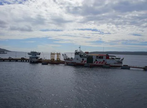 A ferry that is docked Stock Photos