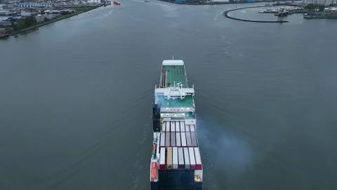 Ferry entering the port. Drone flight over industrial area with cargo ports Stock Footage 319822965