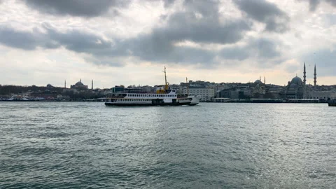 Ferry going on Bosphorus to Galata bridge in Istanbul, cloudy day Stock Footage 237818127