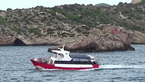 Ferry inter islands sailing close to the coast of Ibiza. Stock Footage 119009465