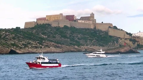 Ferry inter islands sailing close to the coast of Ibiza. Stock Footage 119009480