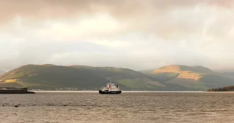 Ferry on a Lake With Hills in the Background Video stock 134357284