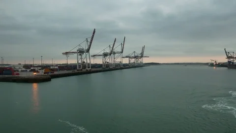 A ferry leaves the harbor Dunkirk towards Great Britain front of cranes 動画素材 102525518